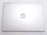 a white laptop with a hp logo on the screen