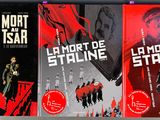 three books on a shelf with a red cover and black covers