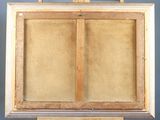 an old wooden easel with a painting on top of it