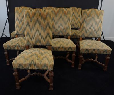 set of six upholstered chairs with upholstered cushions