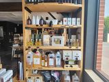 many bottles of alcohol on the shelves in the store