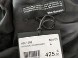 a label on the back of a jacket on a hanger