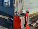 an image of a forklift parked in front of a building