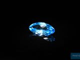 a blue topazte gems on a black background