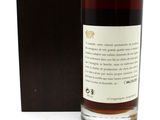 the back of a bottle of whisky sitting next to a box