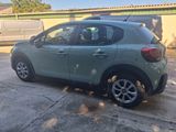 a picture of a small car parked in a parking lot
