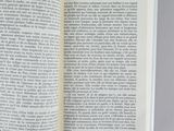 an open book on a table with a white background