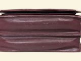 the inside of a brown leather purse with two compartments