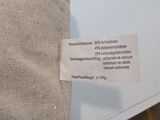 a label on a pillow that says it is made from a piece of cloth