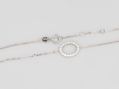 a pair of silver bracelets with diamonds on a white background