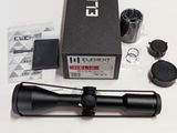 an image of a close up of a rifle scope on a table