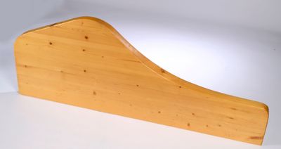 a close up of a wooden object on a white surface