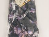 a bag of clothing that is wrapped up on a table