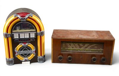 a small radio and an old fashioned radio on a table