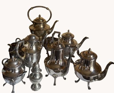 silver plated tea and coffee set with teapots and saucers