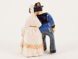a figurine of a man and a woman standing next to each other
