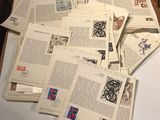 a pile of old books on a table with a pair of scissors