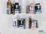 many different types of drill bits on the table
