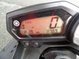 a close up of a motorcycle with a speedometer on it