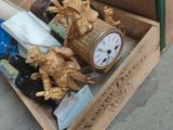 a box with a clock inside of it sitting on the floor