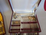 a red case with silverware in it on a table