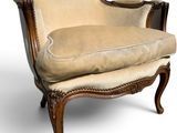 an image of a chair with a beige upholstered upholstered seat