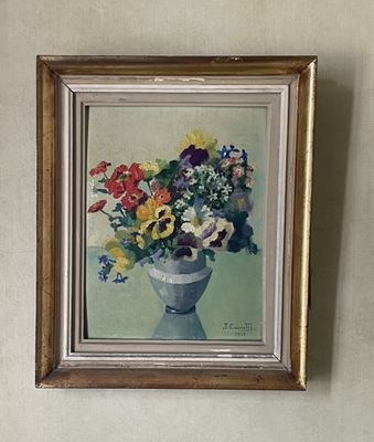 a painting of flowers in a vase hanging on the wall
