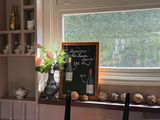 a chalk board on the window sill in the kitchen