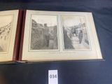 an old photo of a couple of people standing in front of a book