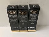 three chanel rouge coco lipsticks on a white surface
