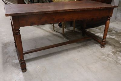 a wooden table with a basket on top of it