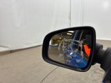 a side view mirror of a motorcycle with a picture of a person in the rear view mirror