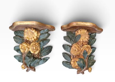pair of carved wood wall sconces with flowers and leaves