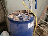 a blue barrel with a hose and a hose attached to it