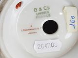 a close up of a white plate with a label on it