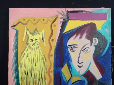 un tableau représentant une femme et un chat accroché au mur