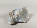 an image of a piece of rock with a stone in the middle of it