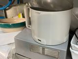 a blender sitting on top of a counter next to a bowl