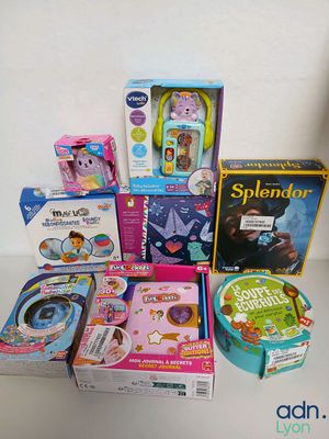 a lot of children ' s toys and books on the table