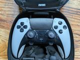 a black and white video game controller in a black case