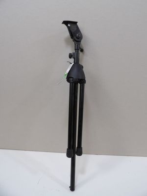 an image of a tripod on a white surface with a white wall in the background