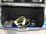 a trunk of a car with a bunch of wires in it