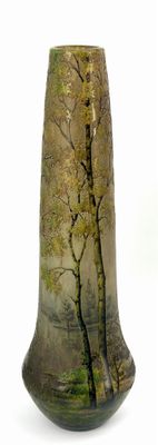 a vase that has a picture of a tree on it