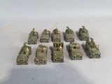 a lot of army vehicles that are sitting on the ground