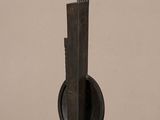 an image of a wooden sculpture on a table with a brown background