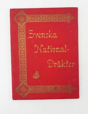 un vieux livre rouge orné d'inscriptions dorées, posé sur une surface blanche