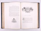 an open book with a drawing of a house on it