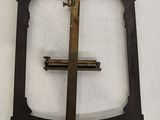 a picture of a metal object with a cross on it