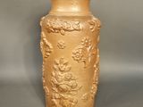 a small vase with a lid on a table