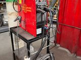 a machine that is sitting on a cart in a garage